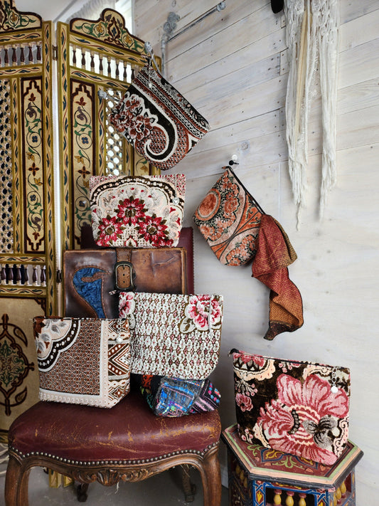 Carpet Bags arranged against a wooden wall backdrop