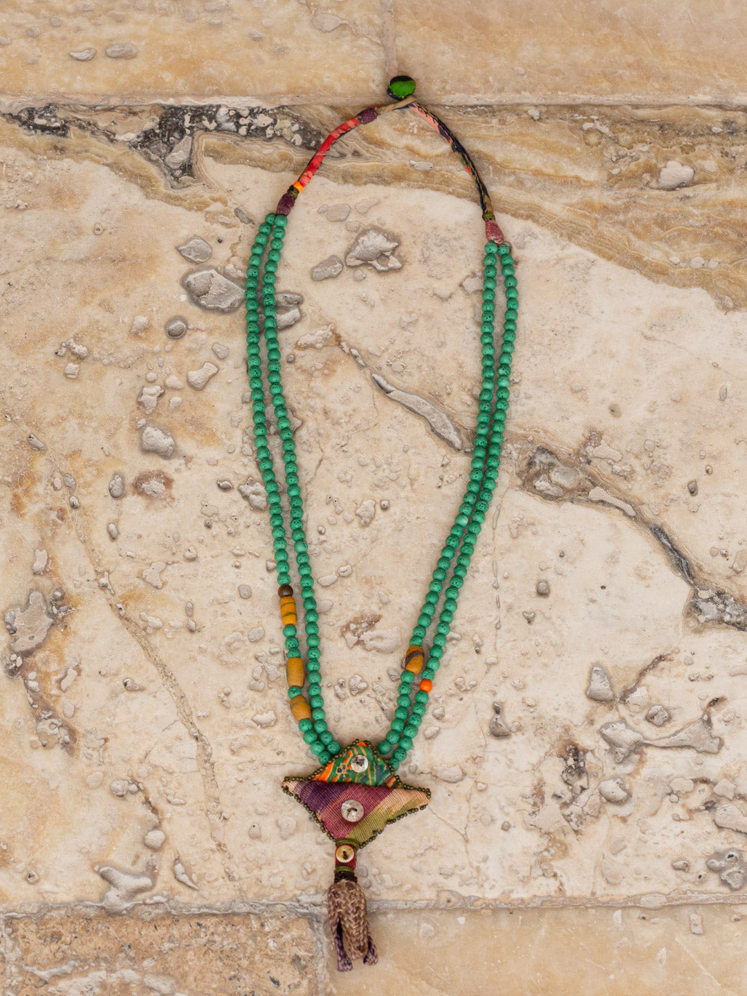 Turquoise Larva Beads with fabric ornament