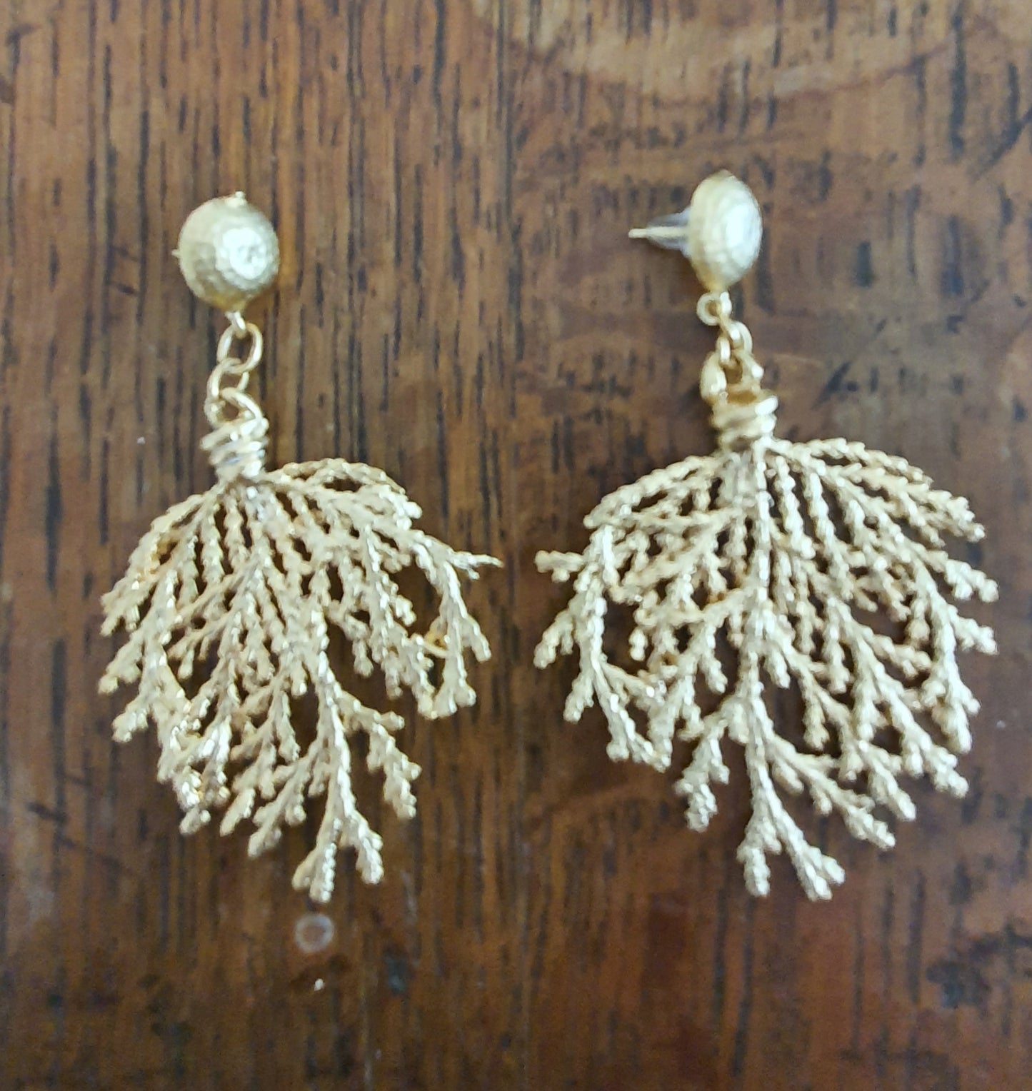 Gold stud earrings with coral dangles