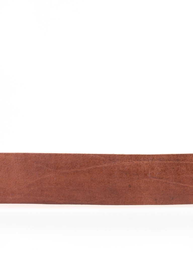 Close up of tan leather belt
