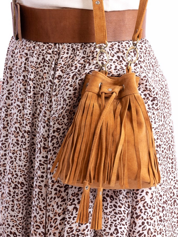 A suede pouch style bag that can be worn as a shoulder or cross body with extendable straps.