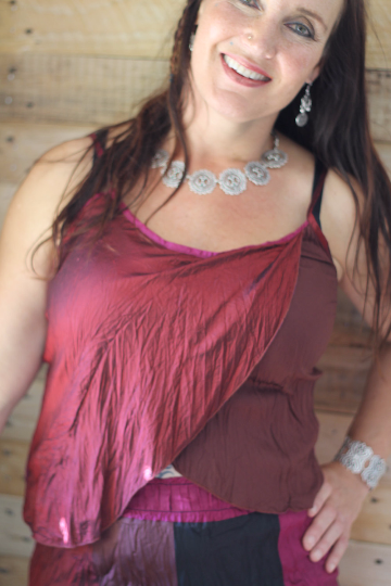 Lady wearing a silk slip in cherry colours