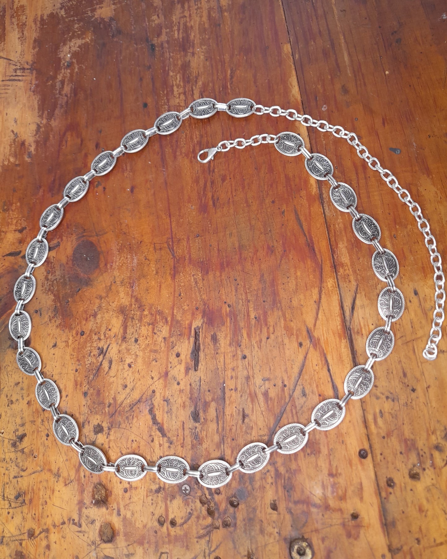 A turkish silver belt with oval detailed discs