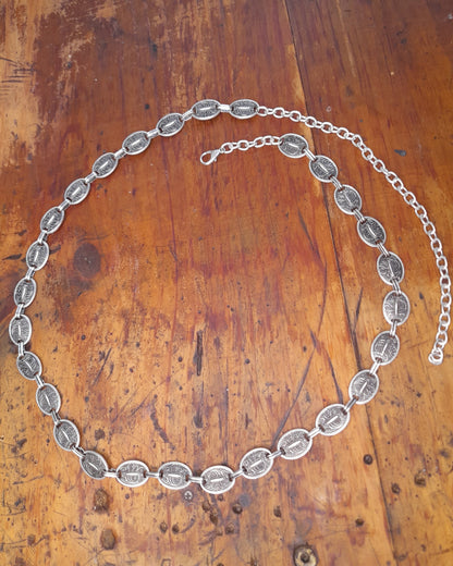 A turkish silver belt with oval detailed discs