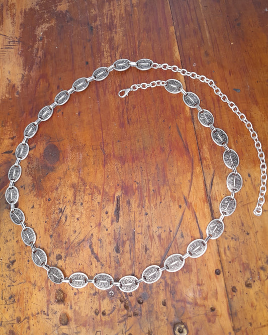 A turkish silver belt with oval detailed discs