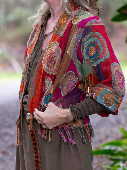 Wool fringed jacket with round spiral design 