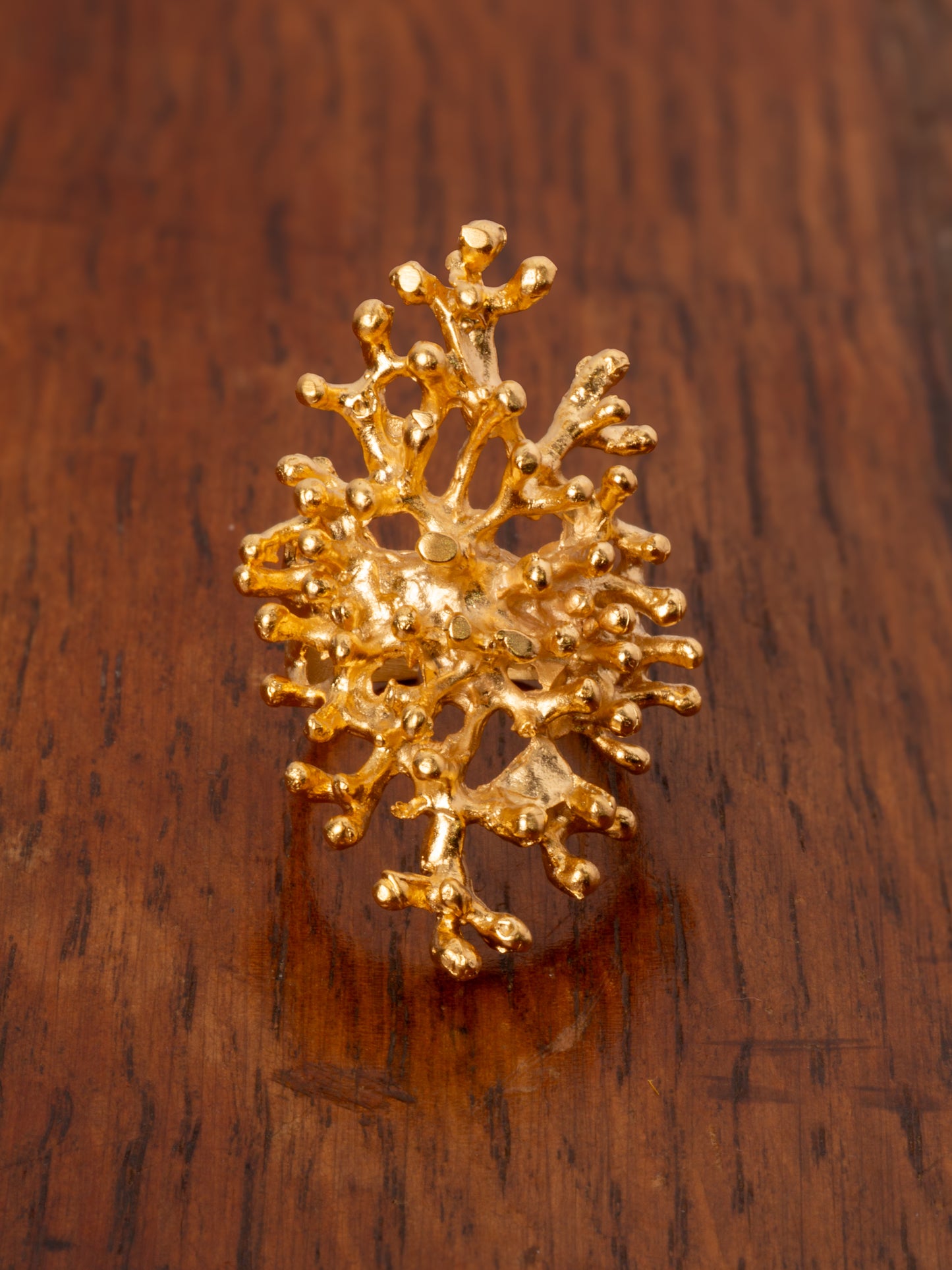 Gold molten larva or coral style ring