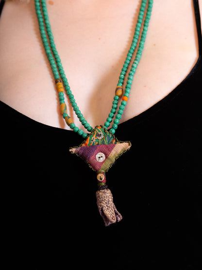 Turquoise Larva Beads with fabric ornament