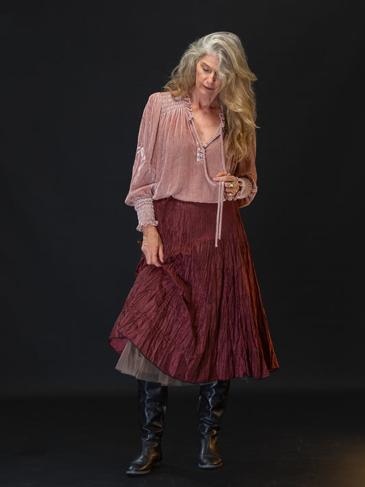 Woman wearing chocolate coloured silk skirt