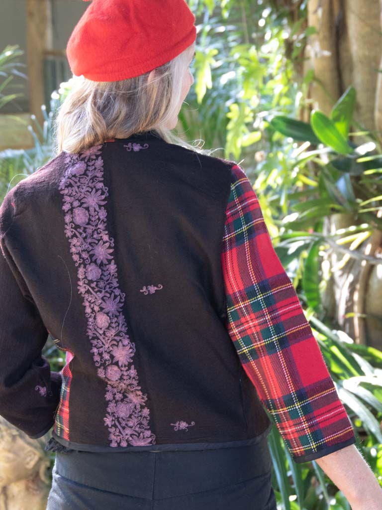 Rear view of hand embroidered wool jacket with tartan