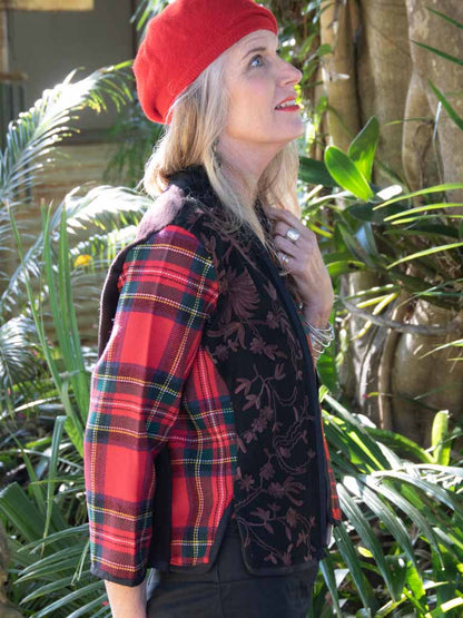 Red tartan wool jacket on woman with red beret