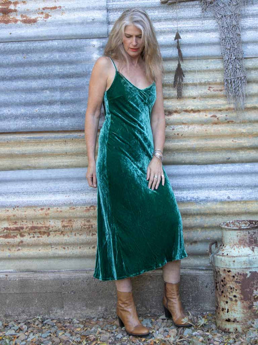 Green velvet slip dress on mature lady