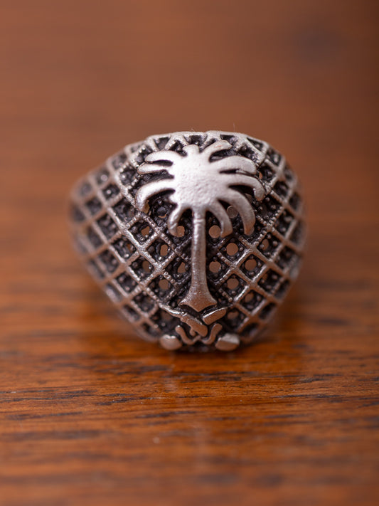 Silver ring with palm emblem 