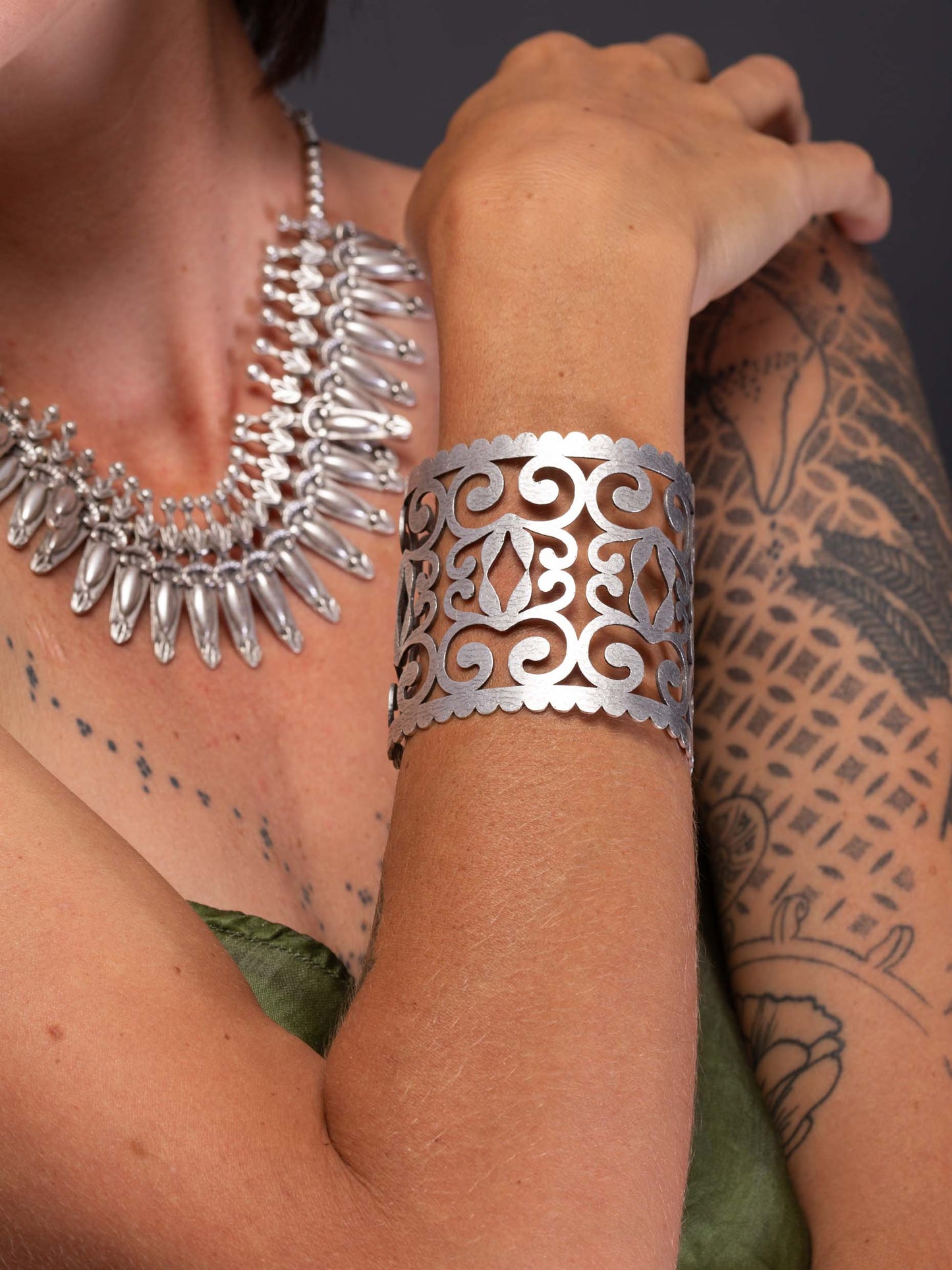 model wearing silver cuff