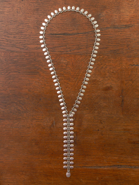 silver tie necklace made from small discs