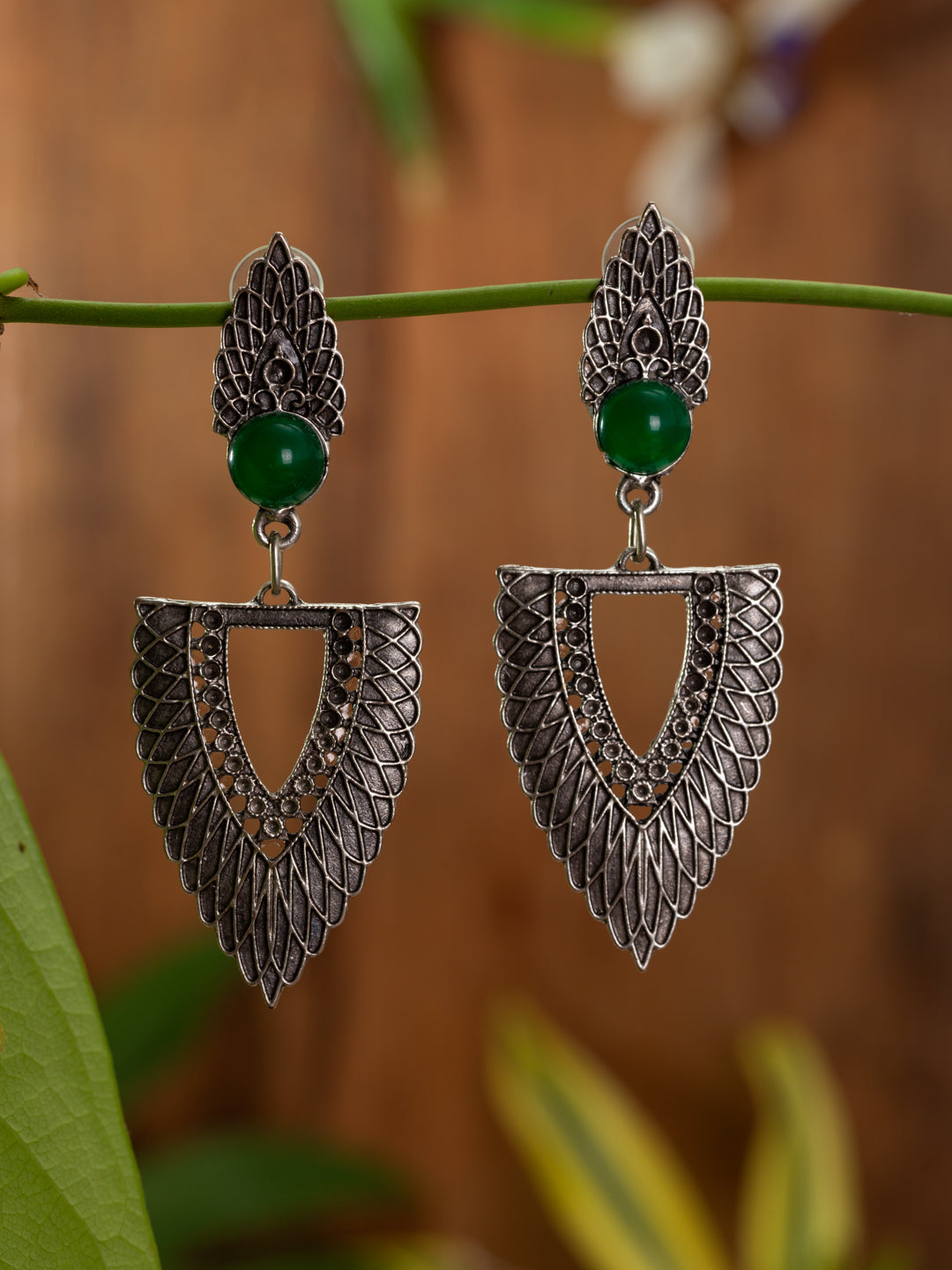 Bold fan style earrings with green gem