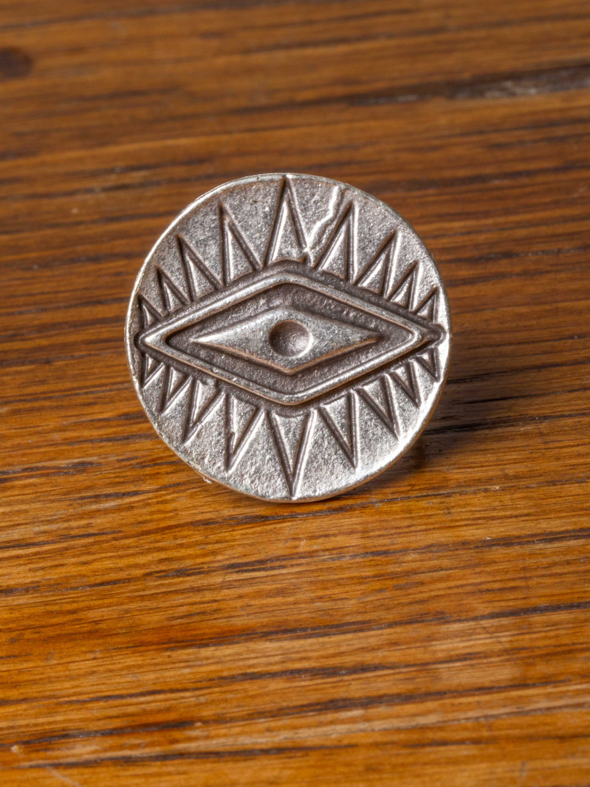 silver ring with diamond eye design