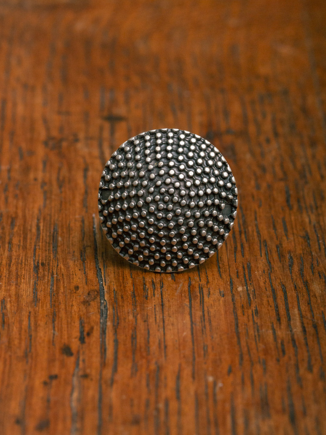 silver ring
with dotty texture