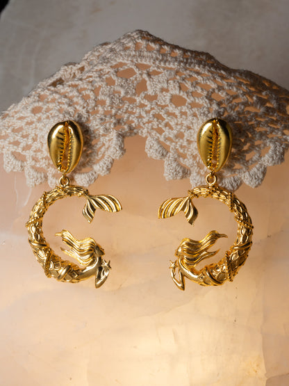 Gold mermaid earrings off a cowrie shell stud