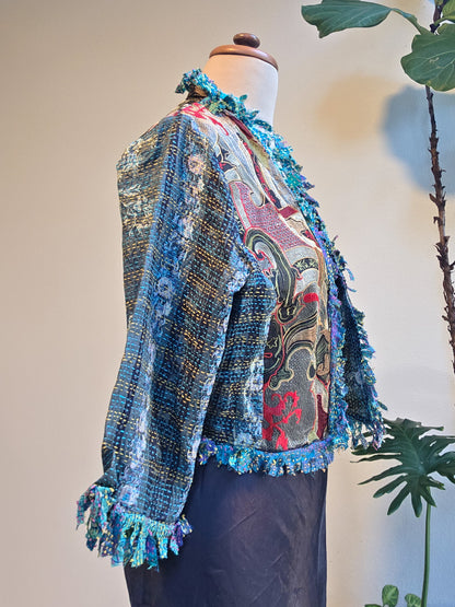 Colorful textured jacket on a mannequin with a neutral background