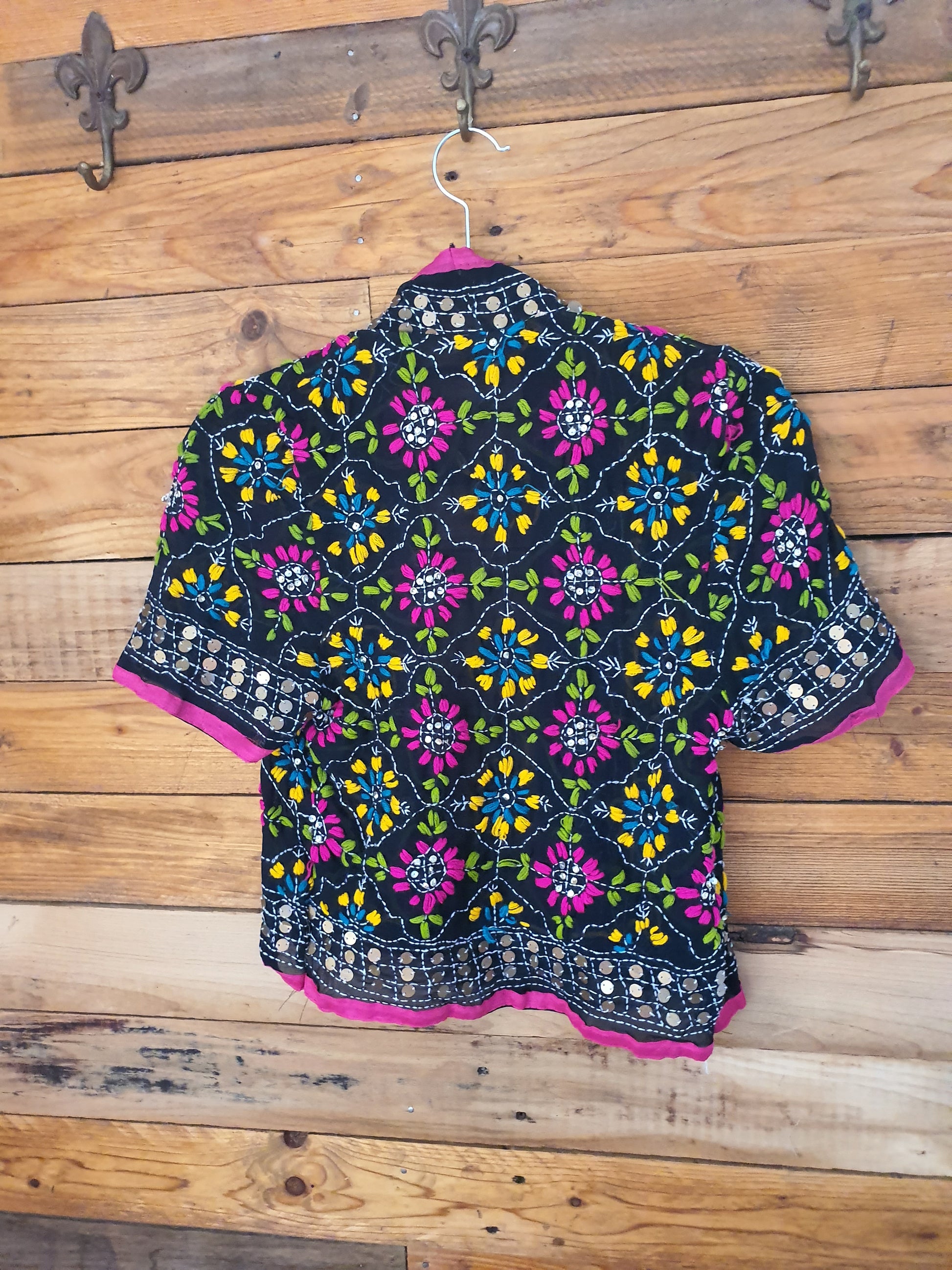 Back view of bolero black with embroidery