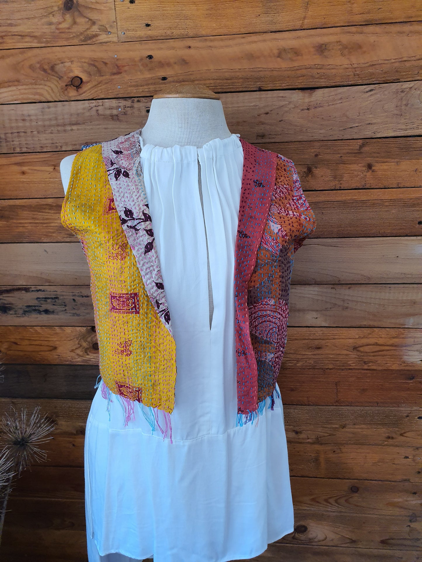 Front view of silk vest reverse side yellow and red