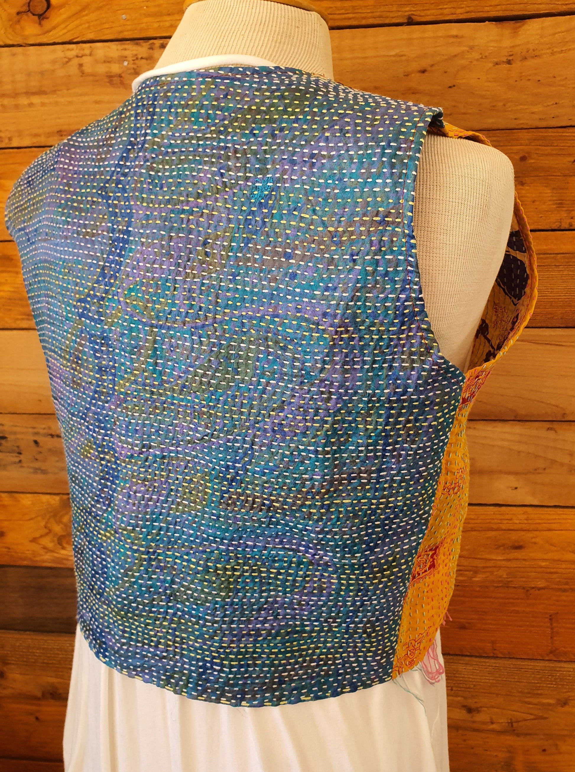 Back view of reverse side of vest blue with hand stich