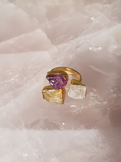 Gold ring with three raw cut crystals