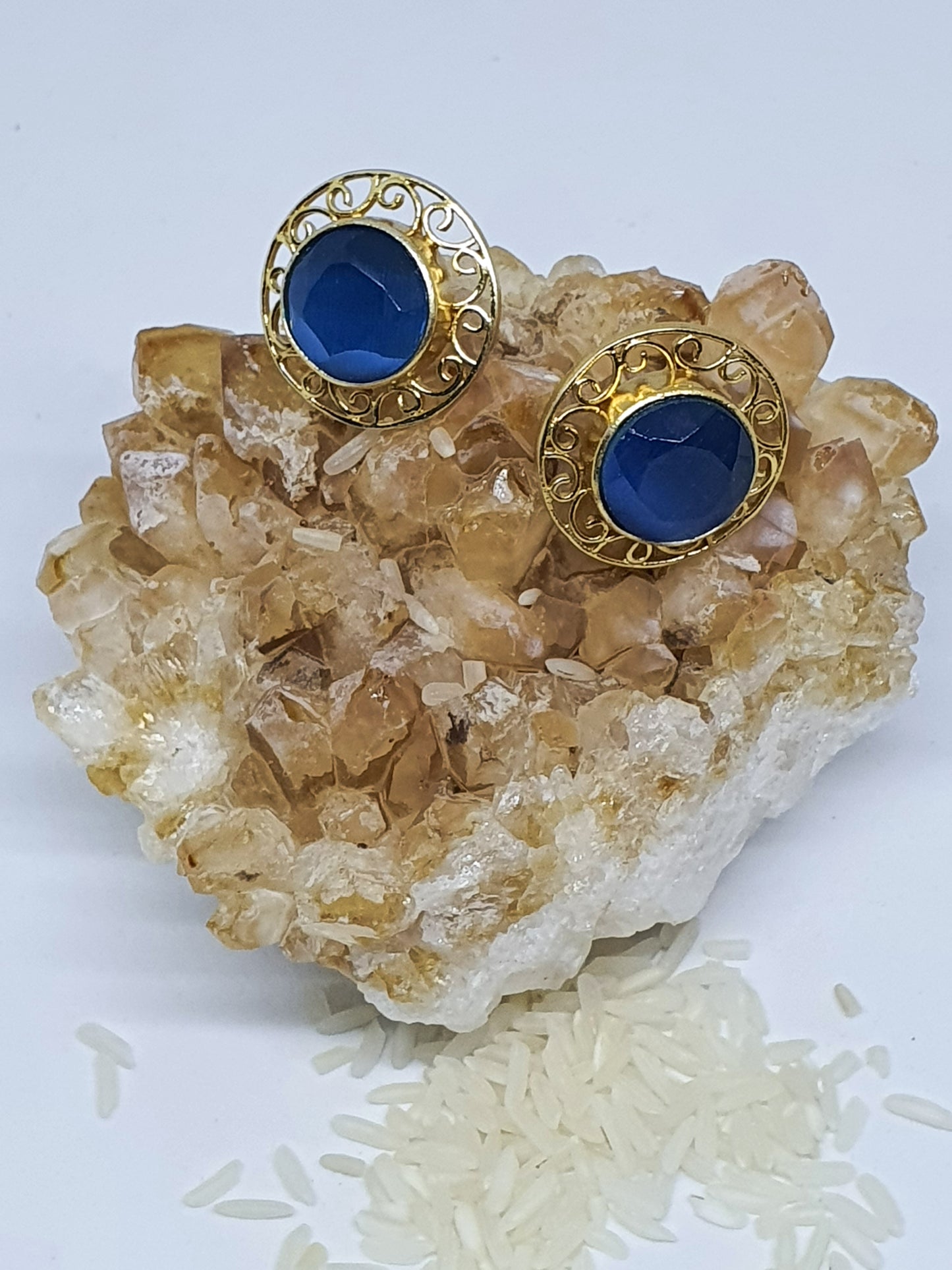 Blue glass with gold filigree detail studs
