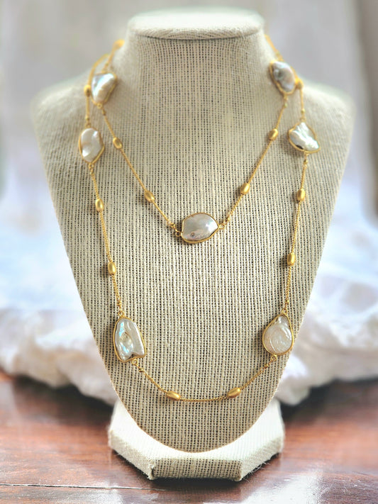 Pearls and gold beads on a long gold single chain
