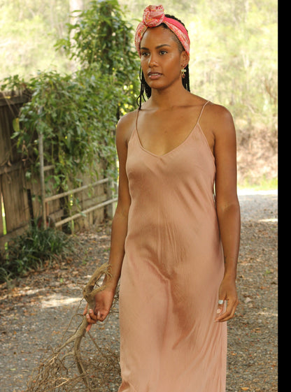 Woman wearing peach colour silk slip