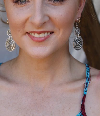 Woman wearing silver earrings