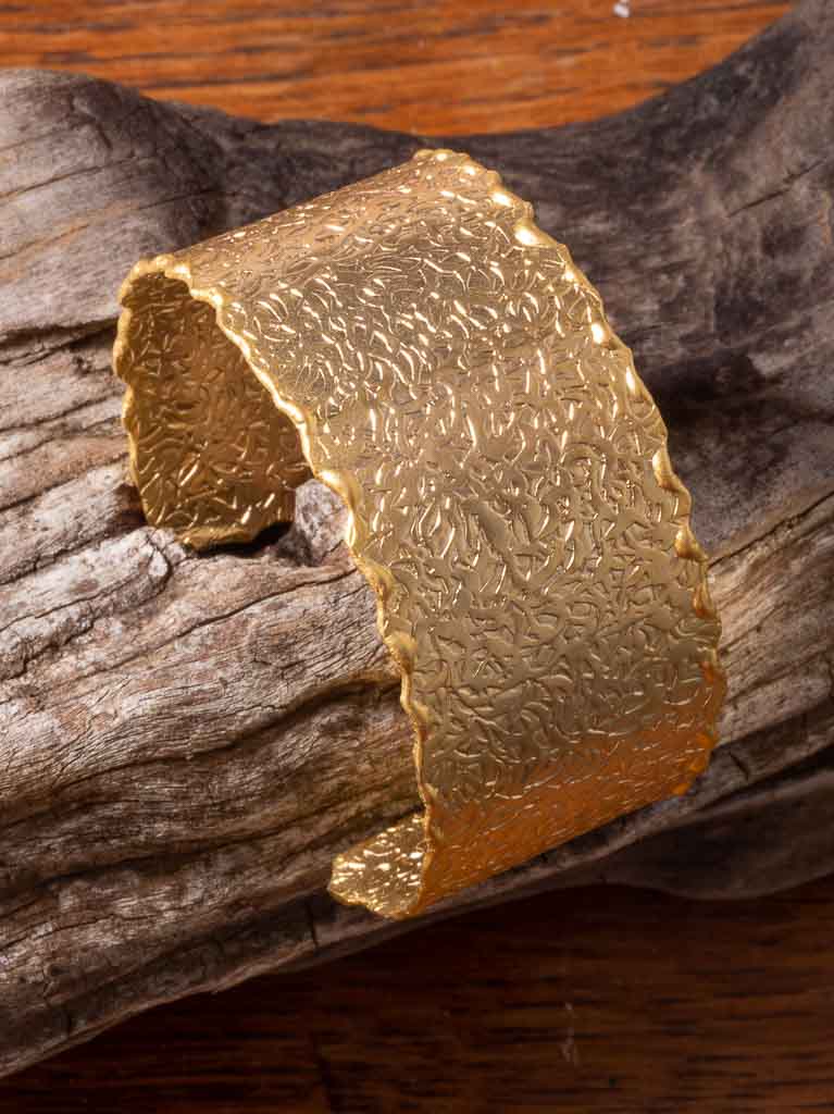 Gold clarity cuff with a fine embossed pattern