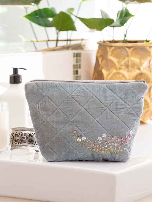 A sweet quilted silk velvet clutch in a soft blue with hand embroidery. Waterproof lining - ideal for cosmetic or toiletries bag