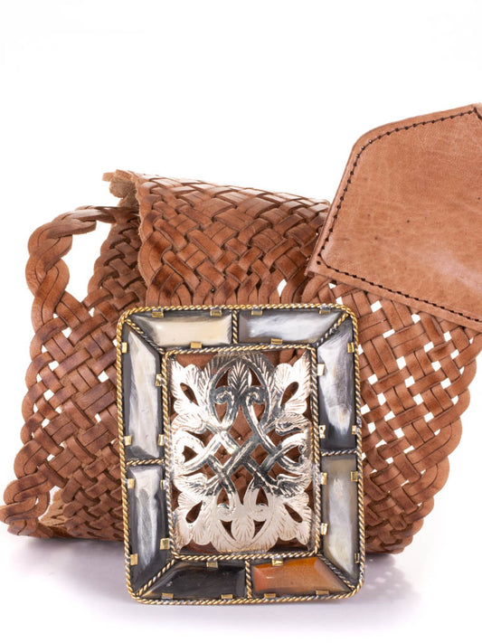 Wide woven tan coloured leather belt with a rectangular bone and filigree metal buckle.