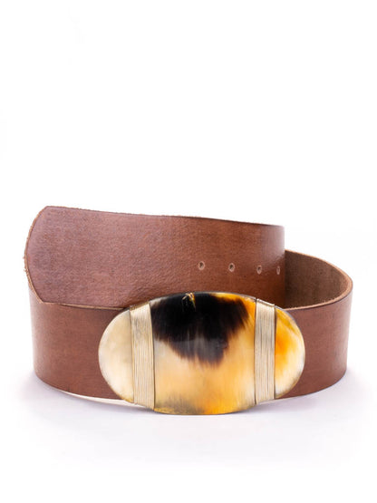 Oval shaped bone and wire buckle on a wide leather tan coloured leather belt.
