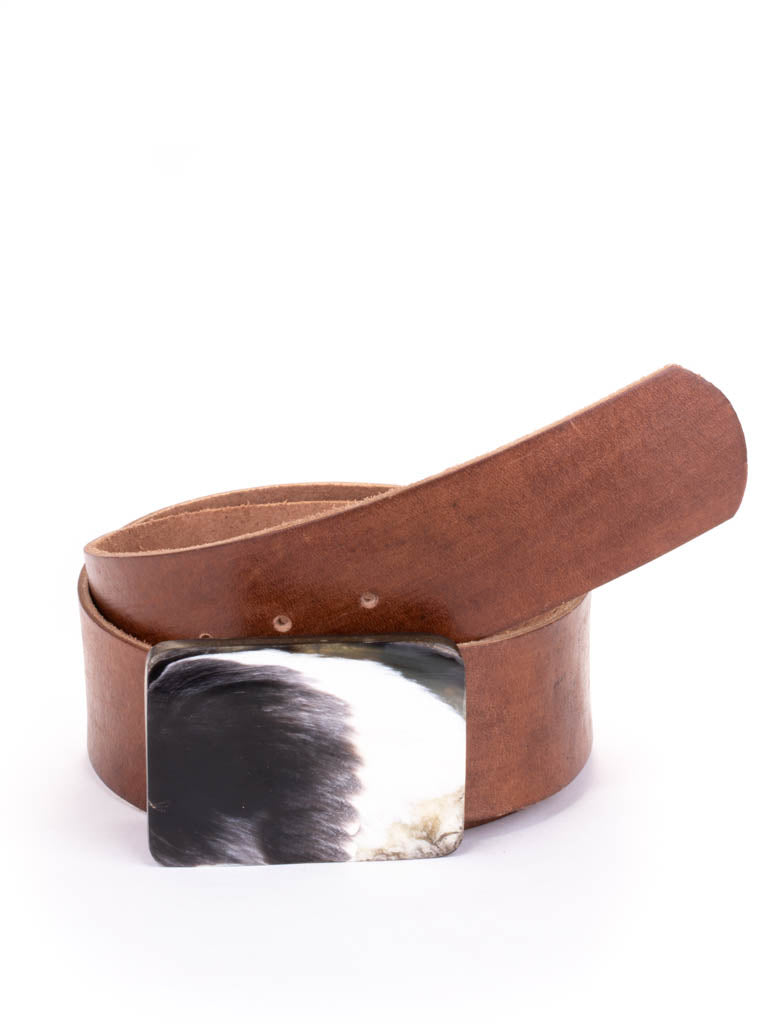 Rectangular bone buckle on a tan leather belt.