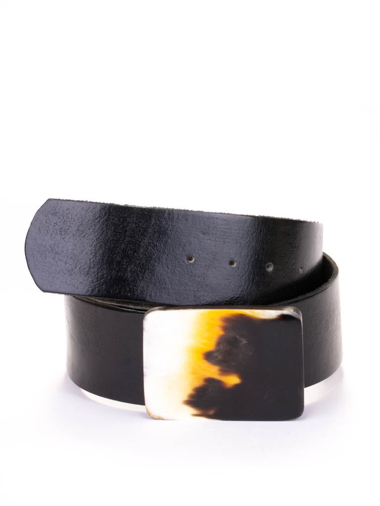 Rectangular bone buckle on a black leather belt.