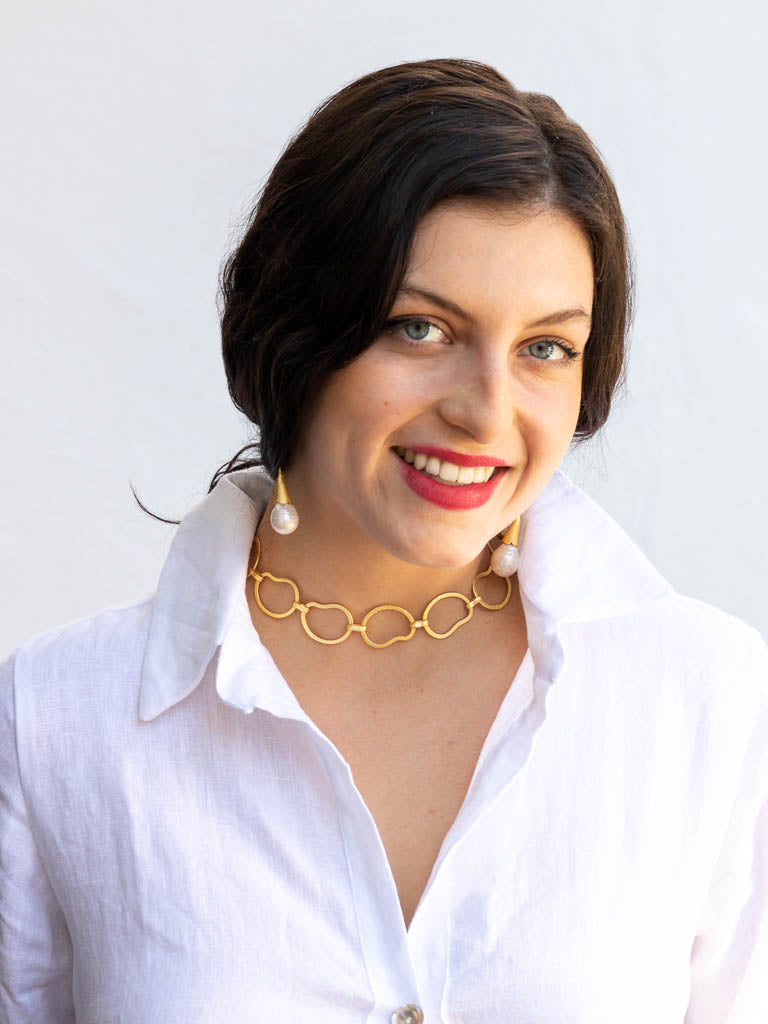 Woman wearing gold chain necklace