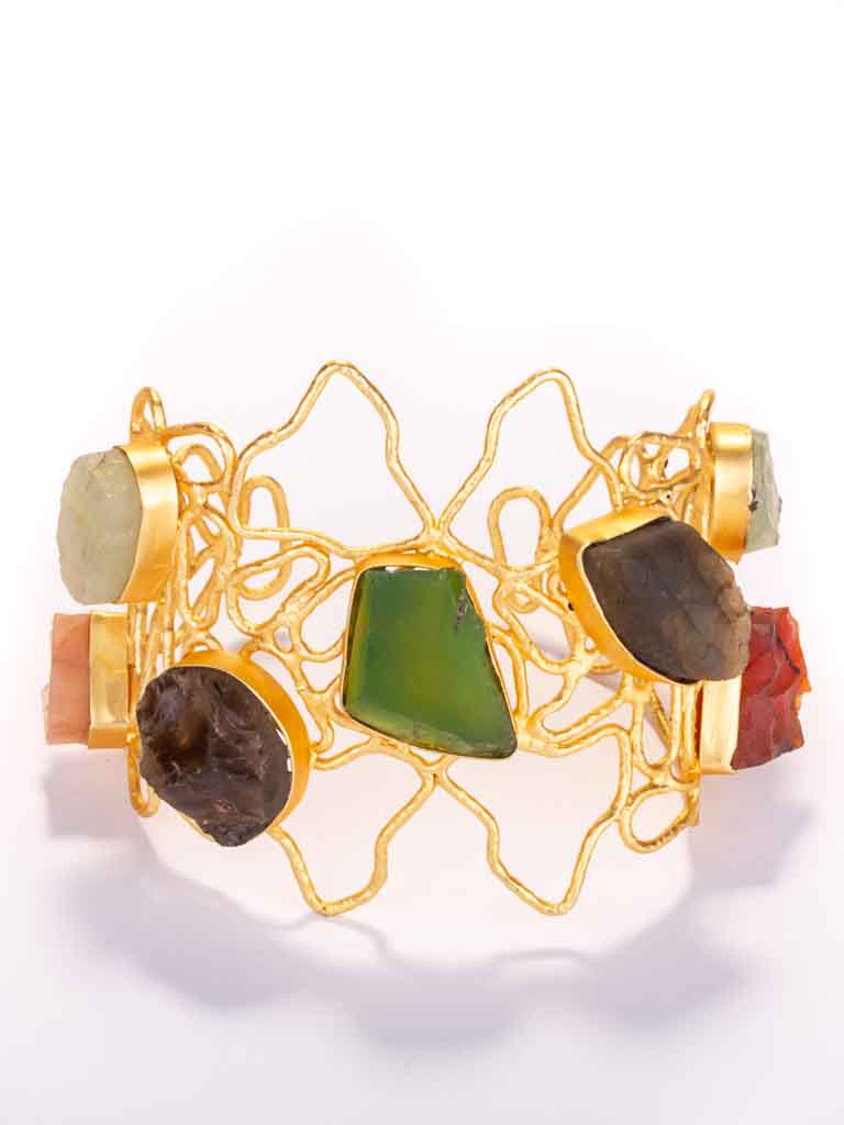 Quality gold-plated brass set with semi precious gems and glass in a squiggly pattern