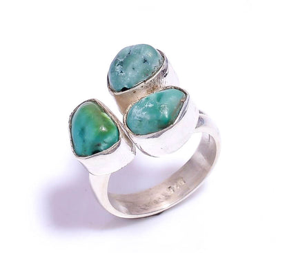 Turquoise stones set in a triple ring setting 