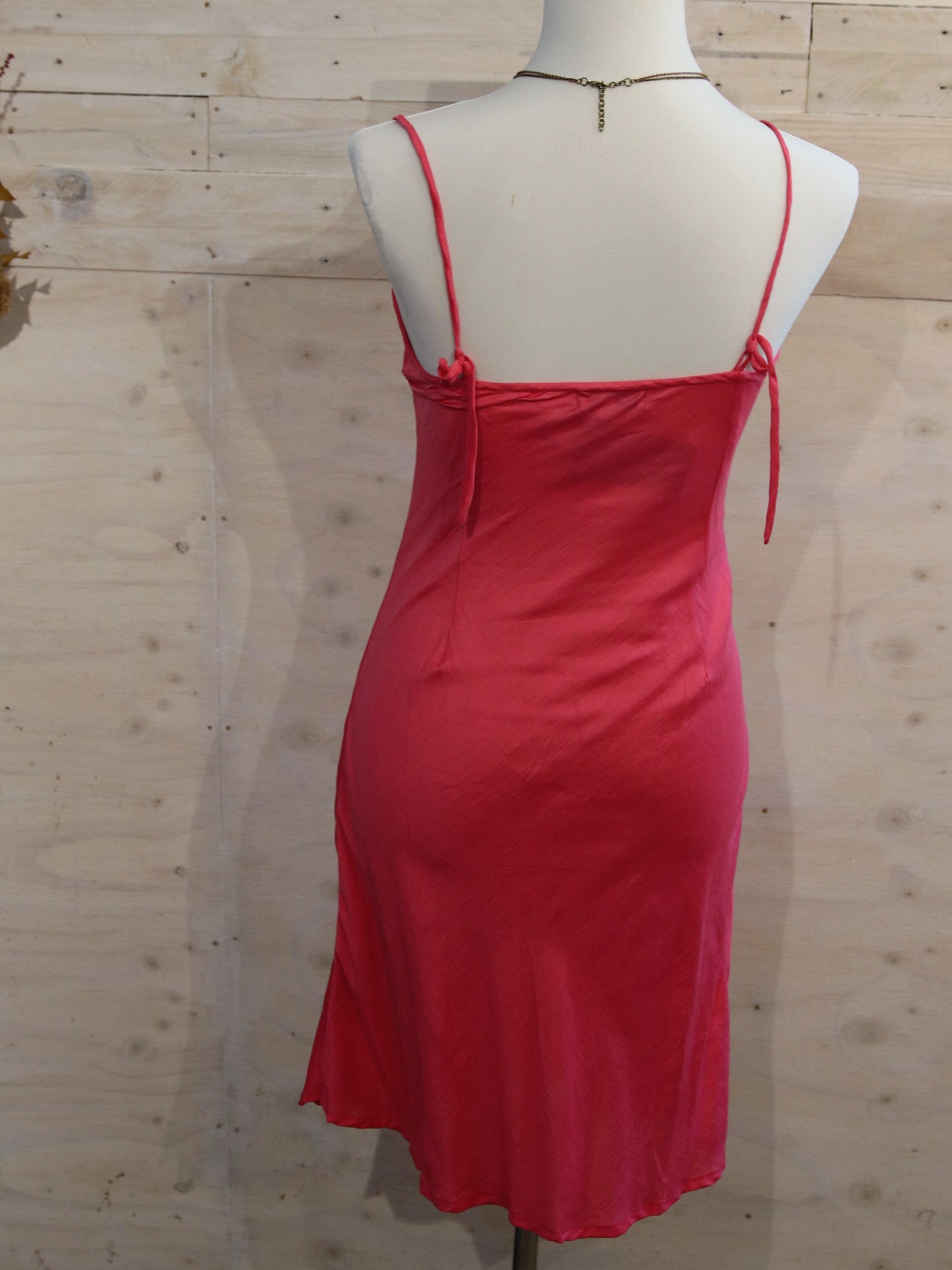 Back view of silk slip in hot pink