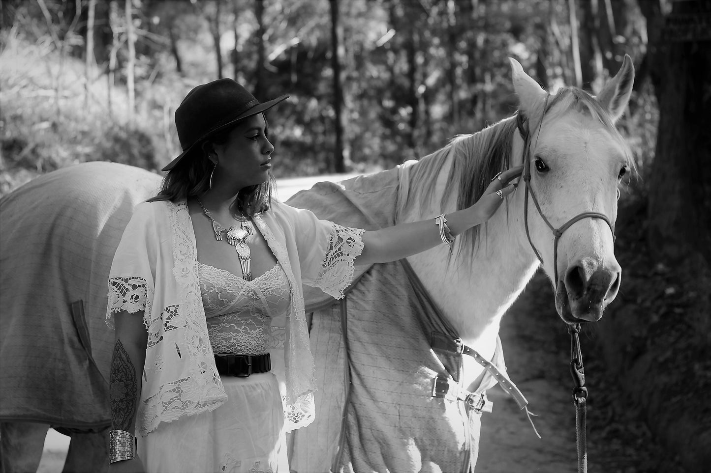 Boho image of woman with horse and jewellery, vintage jacket