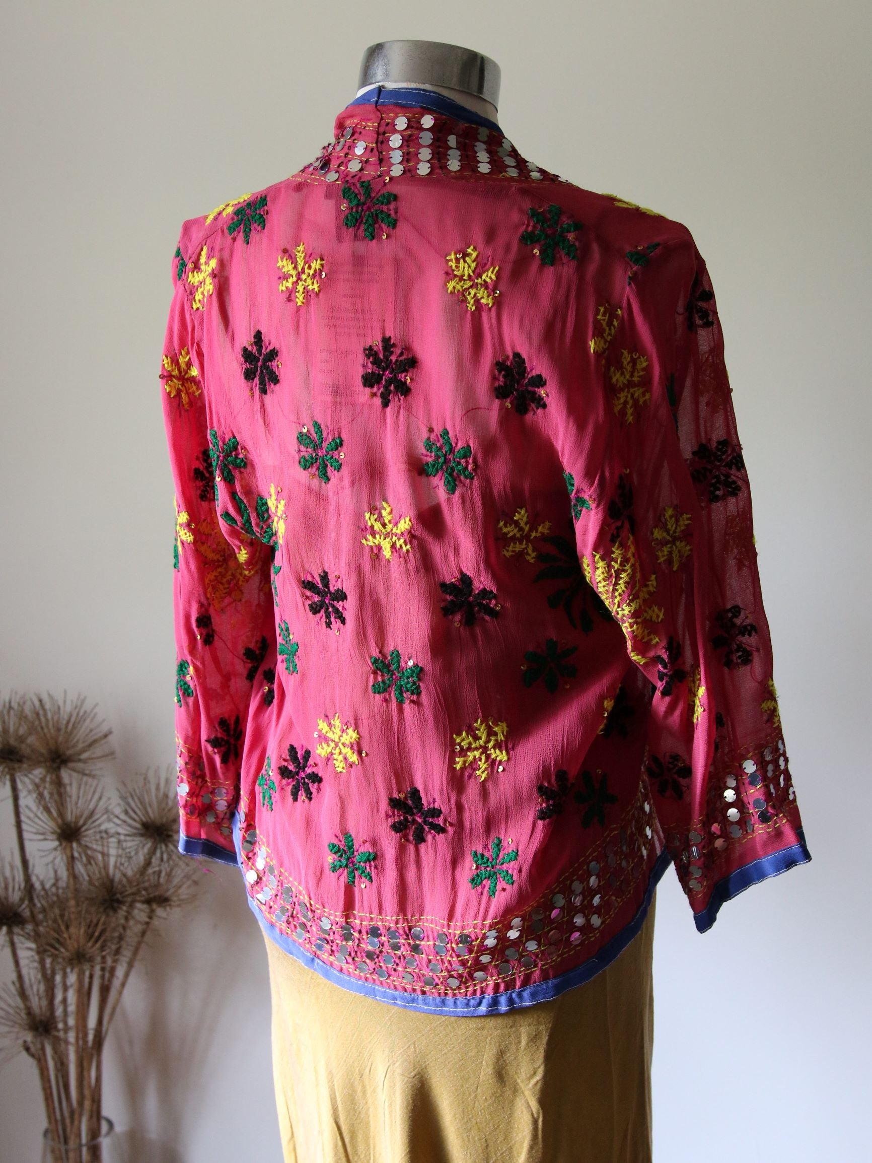 Rear view of pink gypsy jacket with hand embroidery