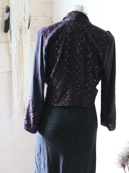 Back view of black silk jacket with hand stiching