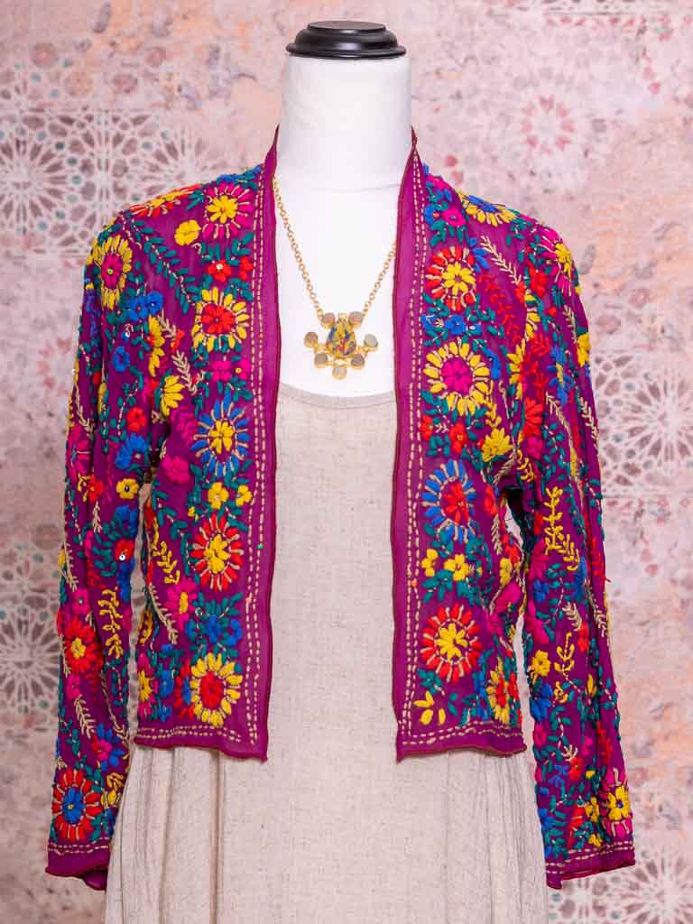 A fuschia coloured silk georgette jacket with hand embroidered flowers