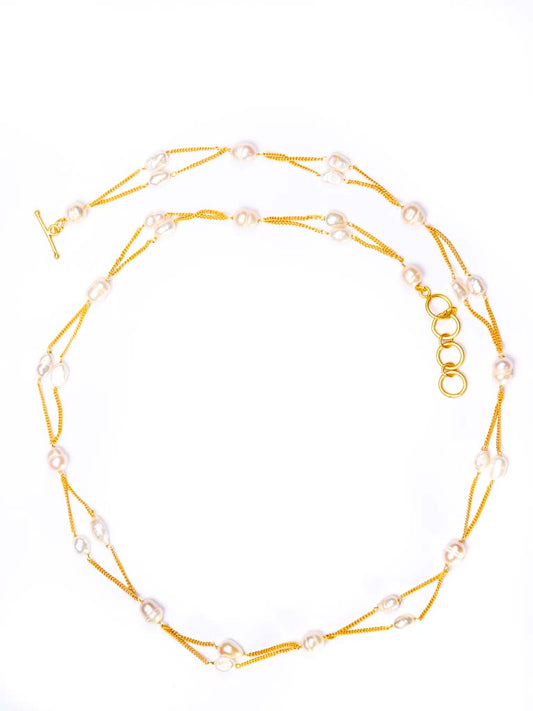 Baroque pearls joined in a stylish diamond shaped strand, chain in a quality gold plated brass , styled with a T-bar catch