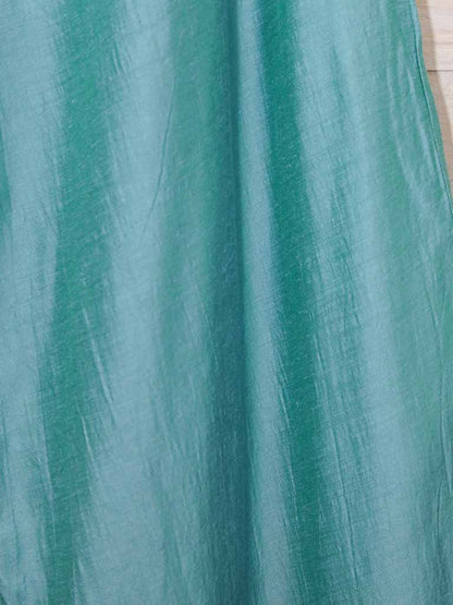 close up of teal coloured silk and linen blended material