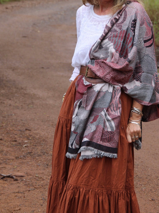 Woman wearing scarf with wide leather belt