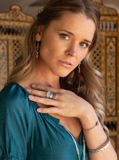 model wearing silver grilled ring